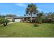 Inviting home exterior featuring a spacious lawn and lush landscaping at 41 Laurel Oaks Cir, Ormond Beach, FL 32174