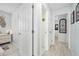 Bright hallway with light flooring and access to bedrooms at 41 Laurel Oaks Cir, Ormond Beach, FL 32174