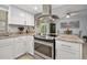 Modern kitchen with stainless steel appliances and granite countertops at 41 Laurel Oaks Cir, Ormond Beach, FL 32174