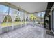Relaxing screened porch with outdoor furniture and view at 41 Laurel Oaks Cir, Ormond Beach, FL 32174