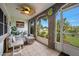 Relaxing screened porch with seating area and view of the backyard at 41 Laurel Oaks Cir, Ormond Beach, FL 32174
