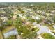 Aerial view of the home with solar panels and a private screened pool at 812 Whiporwill Dr, Port Orange, FL 32127