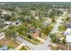 Aerial view of the house with a pool, solar panels, and landscaping in a quiet neighborhood at 812 Whiporwill Dr, Port Orange, FL 32127