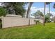 Fenced backyard providing privacy, views of the home and mature trees at 812 Whiporwill Dr, Port Orange, FL 32127