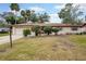 Charming single-story home with manicured shrubs and green lawn at 812 Whiporwill Dr, Port Orange, FL 32127
