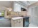 Kitchen features stainless steel appliances and white cabinets at 812 Whiporwill Dr, Port Orange, FL 32127