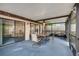 The covered patio has a seating area and ceiling fan that is perfect for relaxing or entertaining guests at 812 Whiporwill Dr, Port Orange, FL 32127