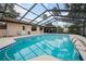 Enjoy swimming in the privacy of your own pool, screened in and surrounded by lounge chairs at 812 Whiporwill Dr, Port Orange, FL 32127