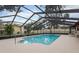 The screened-in pool provides privacy and safety while you enjoy the water at 812 Whiporwill Dr, Port Orange, FL 32127