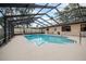 A screened-in pool provides privacy and safety, surrounded by a large patio perfect for lounging and entertaining at 812 Whiporwill Dr, Port Orange, FL 32127