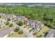 Aerial view of a home in a community surrounded by scenic ponds and woodlands at 820 Aldenham Ln, Ormond Beach, FL 32174