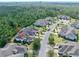Aerial view of property in established community with mature landscaping at 820 Aldenham Ln, Ormond Beach, FL 32174