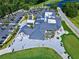 Aerial perspective of the clubhouse, parking area, and surrounding green spaces at 820 Aldenham Ln, Ormond Beach, FL 32174