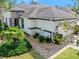 Beautiful exterior of a home in a manicured community with lush landscaping at 820 Aldenham Ln, Ormond Beach, FL 32174