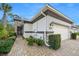 Charming home featuring a 2-car garage, well-maintained landscaping, and a beautiful stone facade at 820 Aldenham Ln, Ormond Beach, FL 32174
