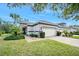 Beautiful home with a two car garage, manicured lawn and stone accents at 820 Aldenham Ln, Ormond Beach, FL 32174