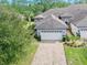 Beautiful aerial of a home with a brick paver driveway and two car garage at 820 Aldenham Ln, Ormond Beach, FL 32174