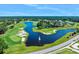 Picturesque view of the golf course with water features and lush greenery at 820 Aldenham Ln, Ormond Beach, FL 32174