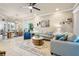 Bright living room open to dining area featuring neutral decor and tile flooring at 820 Aldenham Ln, Ormond Beach, FL 32174