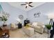 Comfortable living room with light blue walls, cozy seating, and stylish decor at 820 Aldenham Ln, Ormond Beach, FL 32174