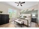 Serene main bedroom featuring calming tones, a decorative wall, and ample natural light at 820 Aldenham Ln, Ormond Beach, FL 32174
