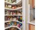 Walk-in pantry with plentiful shelving for maximum storage of food and kitchen supplies at 820 Aldenham Ln, Ormond Beach, FL 32174