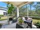 Inviting screened porch with comfortable seating, ideal for outdoor relaxation and entertaining at 820 Aldenham Ln, Ormond Beach, FL 32174