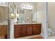Elegant bathroom with double vanity and a shower at 830 Aldenham Ln, Ormond Beach, FL 32174