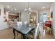 Open concept dining room with large table, chairs and kitchen views at 830 Aldenham Ln, Ormond Beach, FL 32174