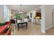 Open concept dining room with large table, chairs, and kitchen view at 830 Aldenham Ln, Ormond Beach, FL 32174
