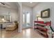 Bright and spacious entryway with tile flooring and a charming sitting area at 830 Aldenham Ln, Ormond Beach, FL 32174