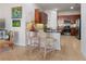 Modern kitchen with granite countertops, stainless steel appliances, and breakfast bar at 830 Aldenham Ln, Ormond Beach, FL 32174