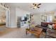 Bright and open living room featuring tile flooring and comfortable furniture at 830 Aldenham Ln, Ormond Beach, FL 32174