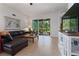 Spacious living room with comfortable sectional sofa and access to backyard at 830 Aldenham Ln, Ormond Beach, FL 32174