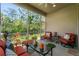 Spacious screened porch with comfortable seating at 830 Aldenham Ln, Ormond Beach, FL 32174
