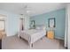 Light and airy bedroom with ceiling fan and neutral decor at 135 Lagoon Ct, New Smyrna Beach, FL 32169