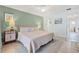 Main bedroom with king-size bed and tranquil decor at 135 Lagoon Ct, New Smyrna Beach, FL 32169