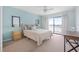 Bedroom with water view, sliding door, and ceiling fan at 135 Lagoon Ct, New Smyrna Beach, FL 32169