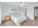 Bedroom with queen-size bed and light color scheme at 135 Lagoon Ct, New Smyrna Beach, FL 32169