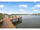 Wooden dock extending over the water with boat slips at 135 Lagoon Ct, New Smyrna Beach, FL 32169