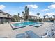 Inviting community pool area with ample lounge chairs at 135 Lagoon Ct, New Smyrna Beach, FL 32169