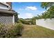 Pathway to waterfront access with green landscaping at 135 Lagoon Ct, New Smyrna Beach, FL 32169