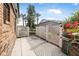 Private patio with grill and white fence at 135 Lagoon Ct, New Smyrna Beach, FL 32169