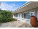 Back patio featuring stamped concrete and a transition into a bright sun room at 188 Benjamin Dr, Ormond Beach, FL 32176