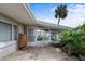 Back patio featuring stamped concrete and a transition into a bright sun room at 188 Benjamin Dr, Ormond Beach, FL 32176