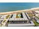 An aerial view of the condo complex on the beach, and the courtyard and pool at 2100 Ocean Shore Blvd # 1150, Ormond Beach, FL 32176