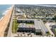 Aerial view of condo complex near the beach, highlighted with a red arrow at 2100 Ocean Shore Blvd # 1150, Ormond Beach, FL 32176