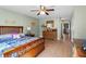 Serene bedroom with warm wooden furniture and a large window, bathed in soft light at 2100 Ocean Shore Blvd # 1150, Ormond Beach, FL 32176