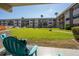 Condo courtyard featuring manicured lawn and walkways surrounded by multi-story condo buildings at 2100 Ocean Shore Blvd # 1150, Ormond Beach, FL 32176