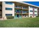 Lovely condo featuring a private patio area with seating and well-maintained lawn space at 2100 Ocean Shore Blvd # 1150, Ormond Beach, FL 32176